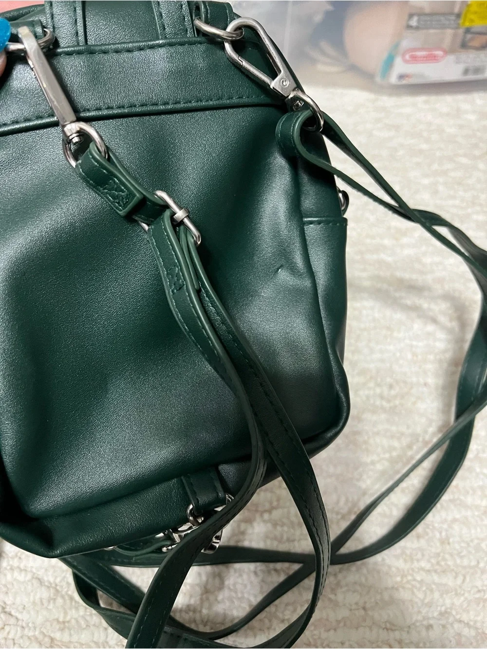 Dark Green Mini Backpack with Silver Crest Detail